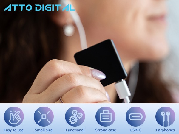 Woman holding the mini voice recording device in hand to playback audio recordings