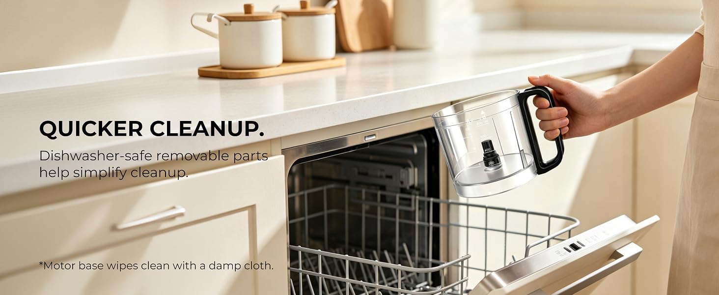 Person holding the removable processor bowl above an open dishwasher for cleanup.