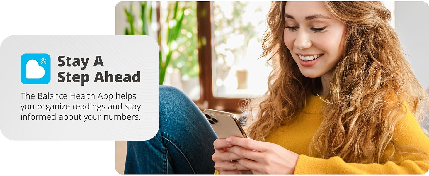 young woman using phone to view balance health app tracking