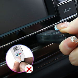 Close-up demonstration of a car door handle showing incorrect usage with a crossed-out circular inset, highlighting proper door operation technique