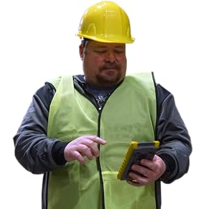 Construction worker using C5000 calculator.