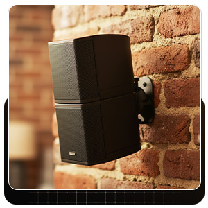 Brick-wall installation showing a tidy wall mount surround sound speakers setup.