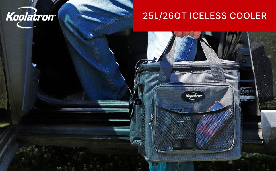 A person in jeans holding the Koolatron 12V cooler bag by the handles stepping into a pickup truck