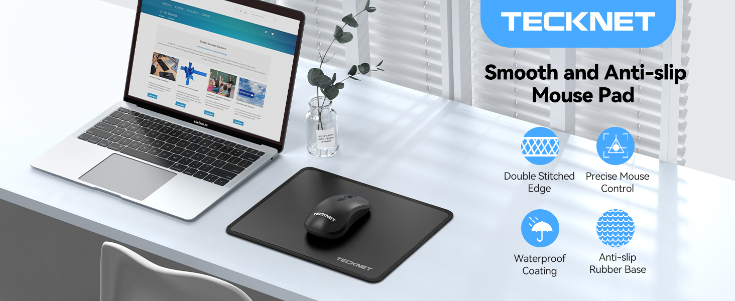 TECKNET smooth and anti-slip mouse pad displayed on a desk with a laptop and mouse. Product features include water-resistant coating and non-slip rubber base.