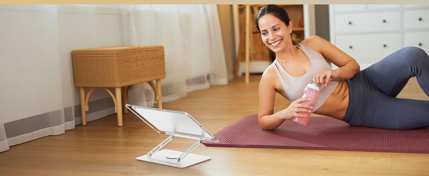 Indoor scene showing relaxation on exercise mat with scattered papers or cards visible on wooden floor.