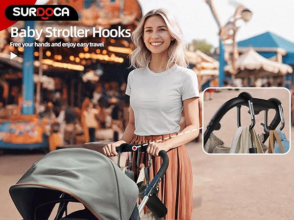 Black stroller hooks attached to a handle, holding various bags. Inset shows close-up of hooks with hanging items. Main image displays stroller with hooks in use.
