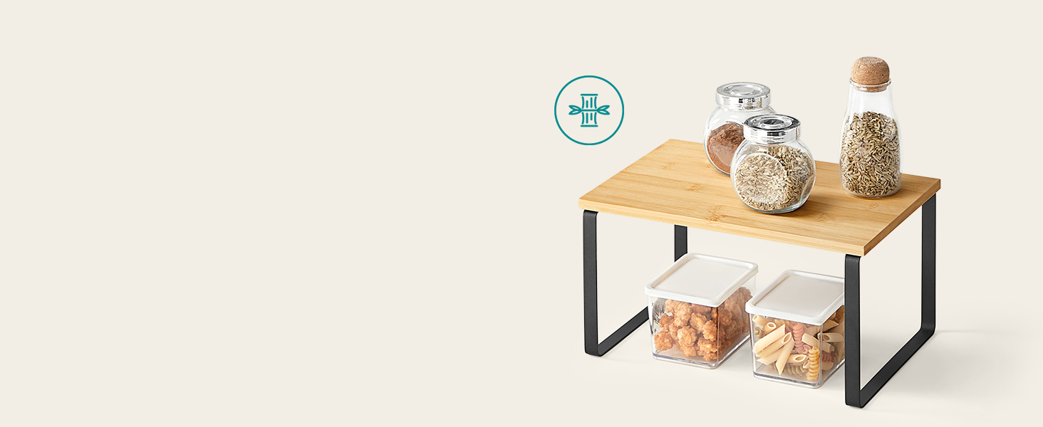 Two-tier wooden and metal storage shelf. Top tier holds three glass jars with ingredients. Bottom tier is empty.