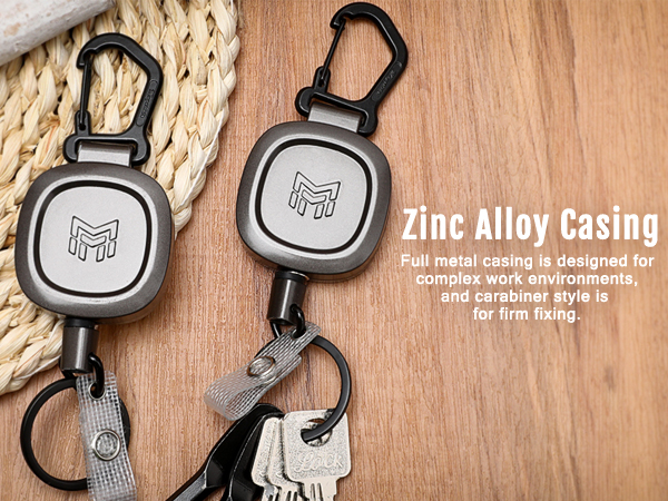 a pair of stainless steel keychain with a rope and a lock.