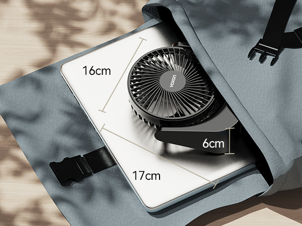 Portable fan attached to a gray bag, with dimensions labeled: 16cm width, 17cm length, and 6cm height. Fan has multiple blades in a circular design.
