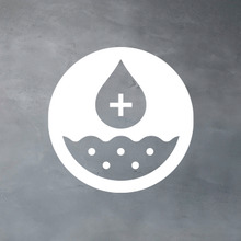 White circle with a plus sign inside a droplet and soil below to represent vitamins and minerals.