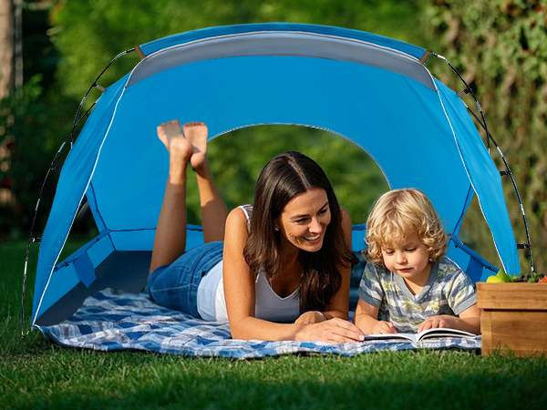mother and her kid are lying in a tent