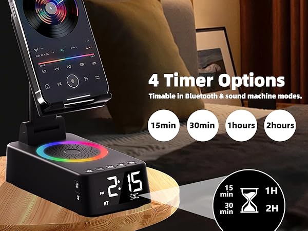 Text reads '4 Timer Options'. Smart alarm clock with wireless charging pad showing digital time display and phone charging capabilities with colorful LED ambient lighting base.