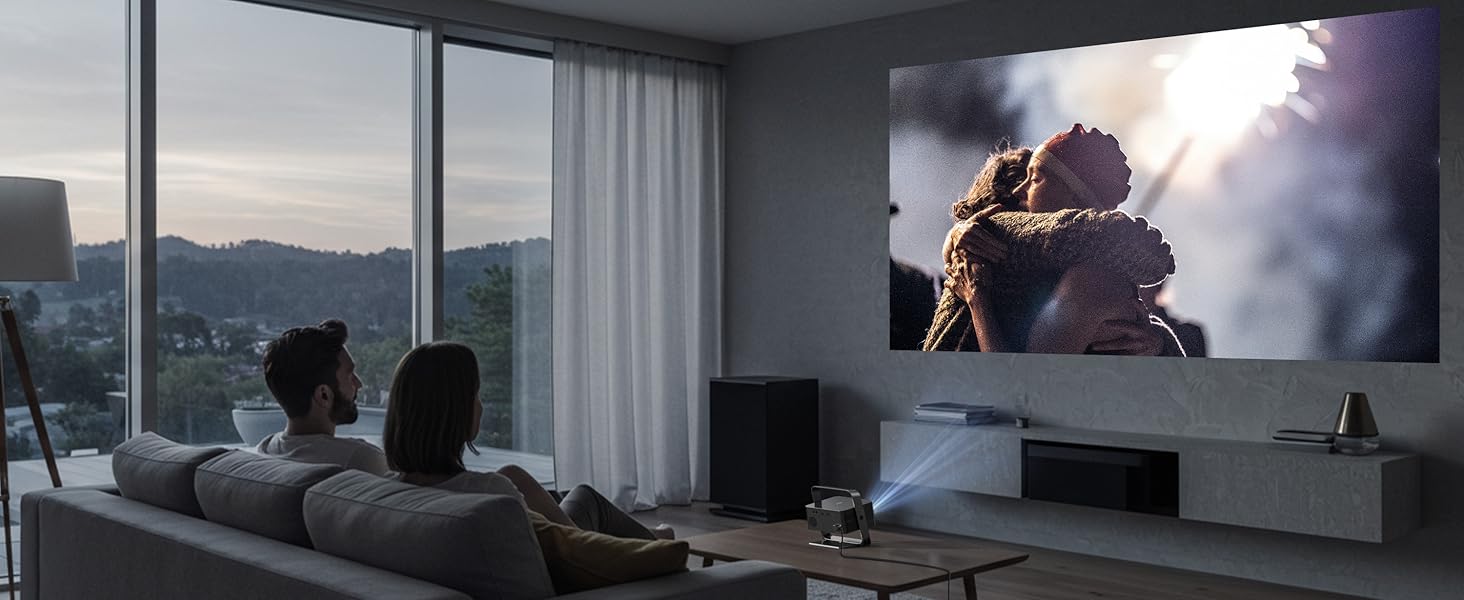 Modern living room with large windows overlooking a cityscape. Gray sofa faces a wall-mounted TV displaying an outdoor scene with sunlight and mist.