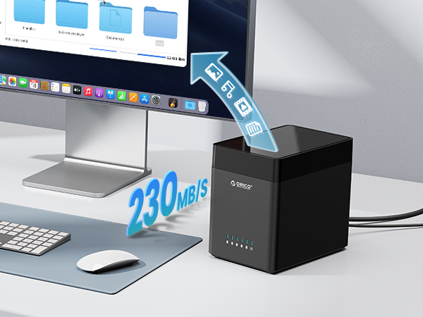 Desktop setup with monitor, keyboard, and mouse. A black cube-shaped device with glowing indicators is shown, with '230 MB/s' text and data transfer icons.