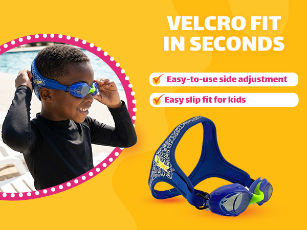 Boy adjusting blue kids swimming goggles using the easy velcro strap