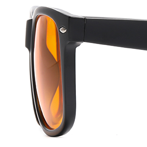 Side view of sunglasses frame showing black plastic construction with orange-tinted gradient lens and visible hinge detail.