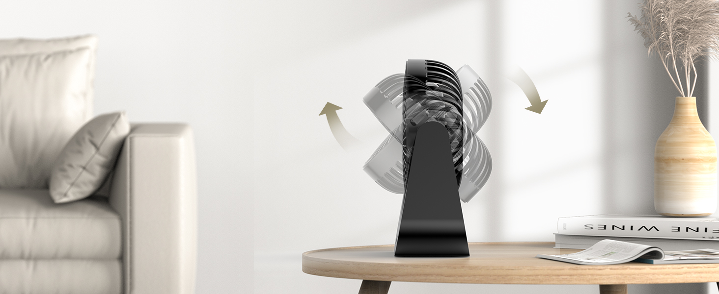 Black oscillating fan on wooden table in a living room setting, with arrows indicating air movement.