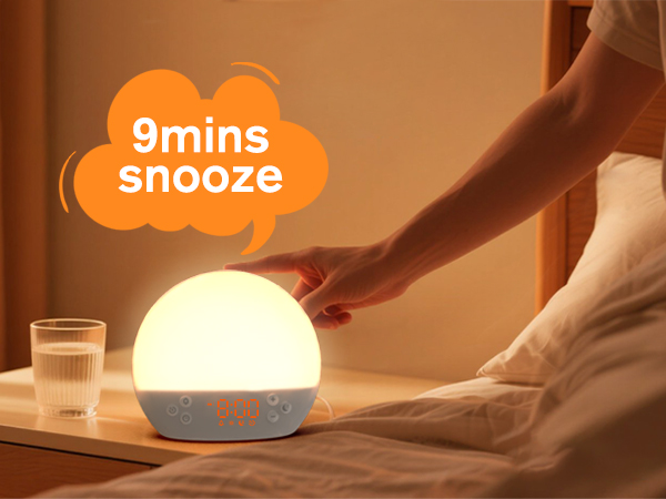 Text reads '9mins' and 'snooze'. Warm-toned image of morning scene with glowing lamp and coffee cup on bedside table.