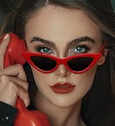 a woman wearing sunglasses and a red phone