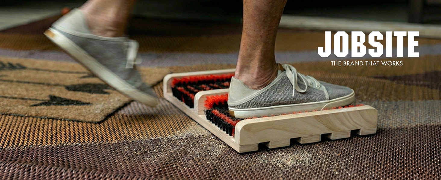 Close up of jobsite boot brush flat scrubber in use in front of RV