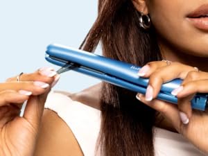 Woman using straightener