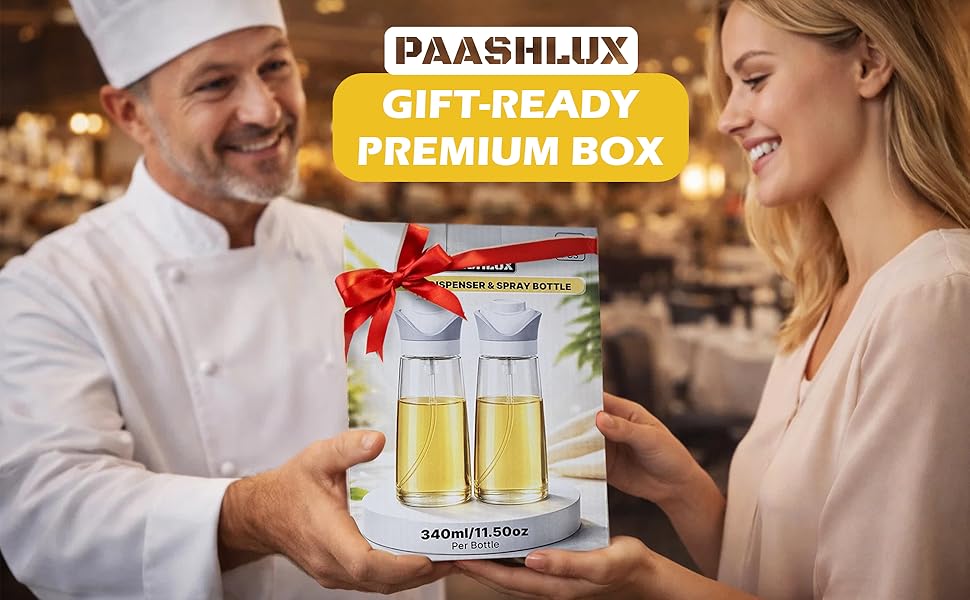 A Paashlux gift box with oil dispenser set. Box tied with red ribbon. Warm, festive setting.