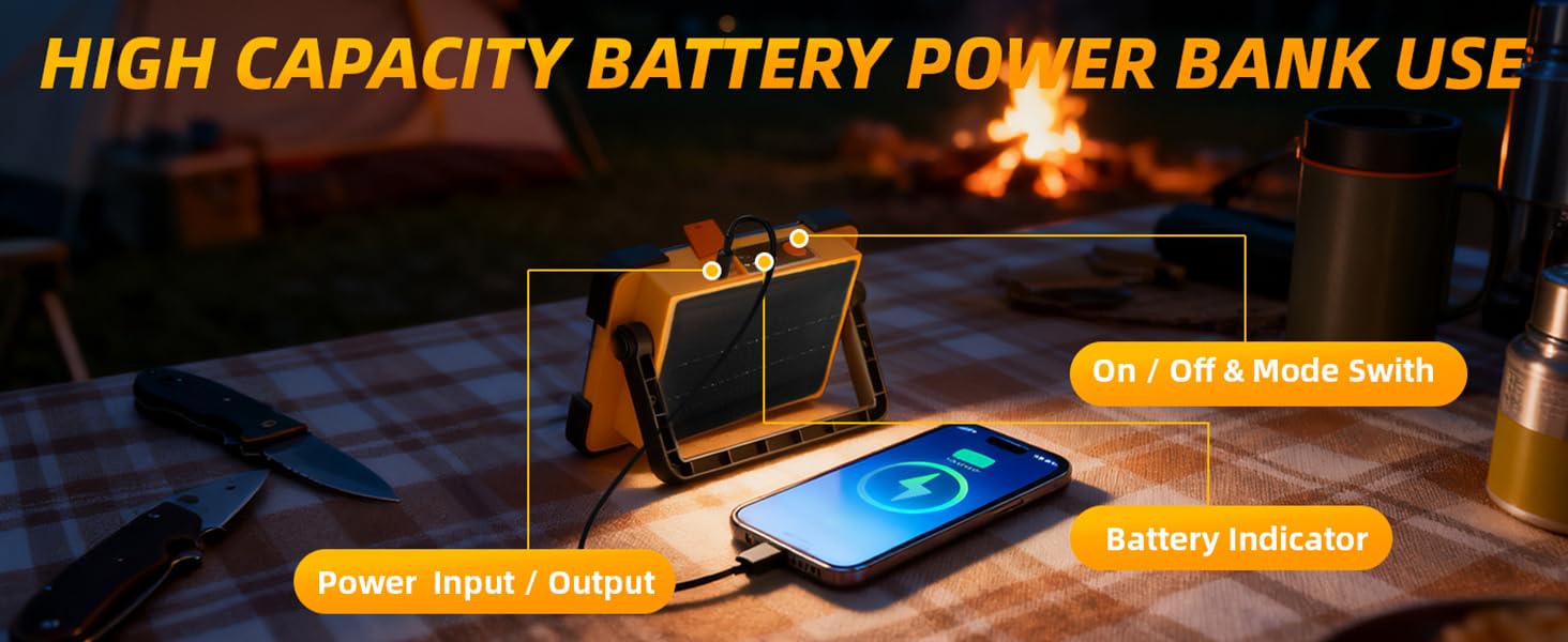 LED work light with USB output charging smartphone at campsite picnic table