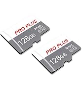 Wide photo of mountain landscape at sunset or sunrise with warm orange sky and silhouetted rocky peaks. Photography-focused scene composition.