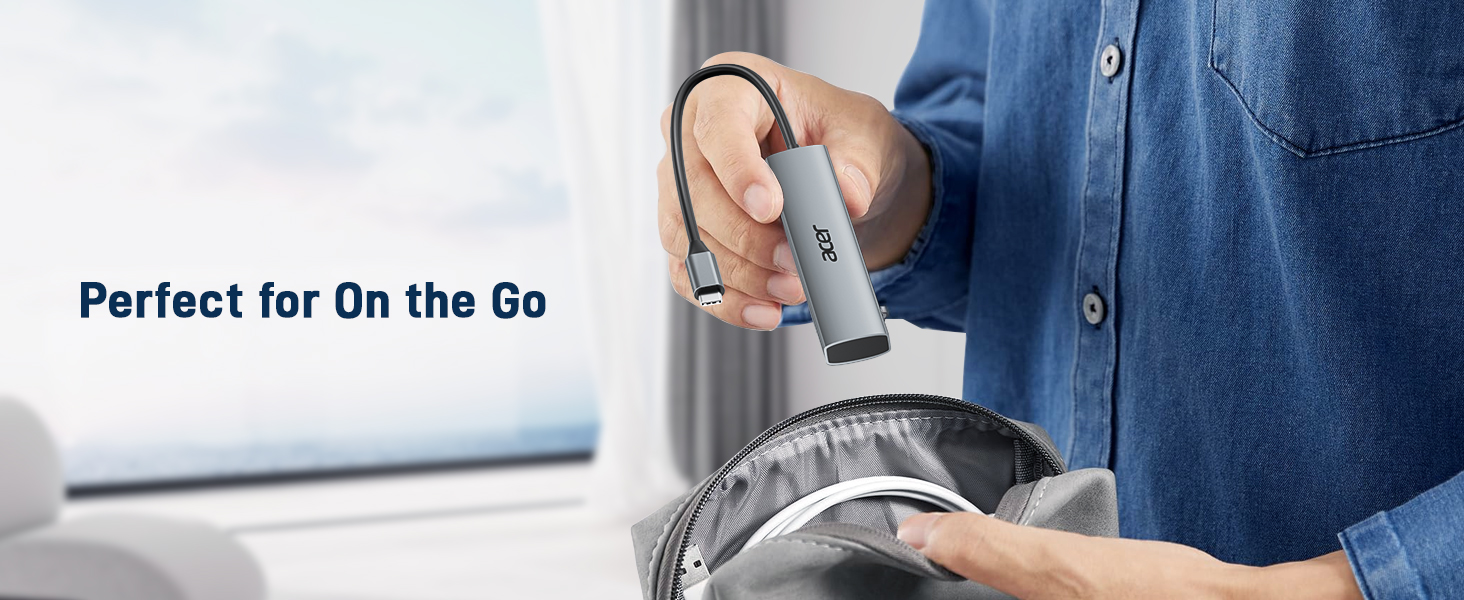 Handheld steam cleaner in use, cleaning a surface. Text reads 'Perfect for On the Go'.