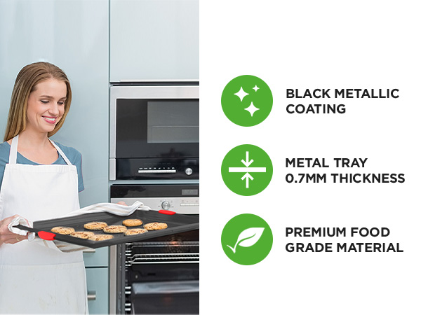 woman holding non stick cookie sheet with freshly baked cookies kitchen baking using baking pan