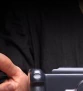 a person holding a camera in their hand.