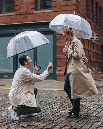 rainy engagement, proposal with umbrellas