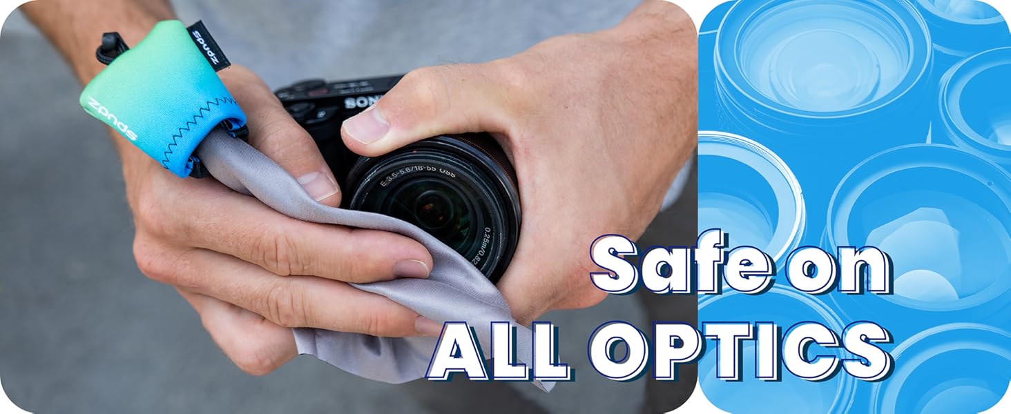 A photographer cleans off camera lens with Spudz microfiber cloth.
