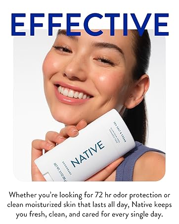 Woman smiling with Native's clean deodrant - showcasing Native's range of clean personal &amp; hair care