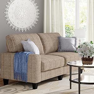 White sofa couch with wood and metal coffee table in modern living room