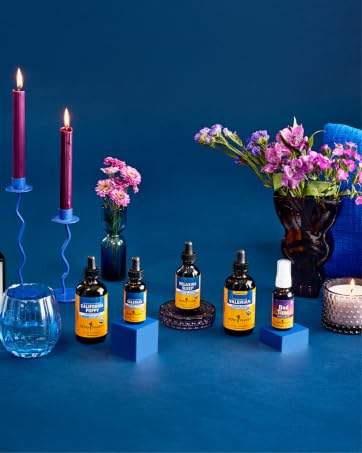 Herb Pharm sleep supplements on a dark blue background with candles lit.