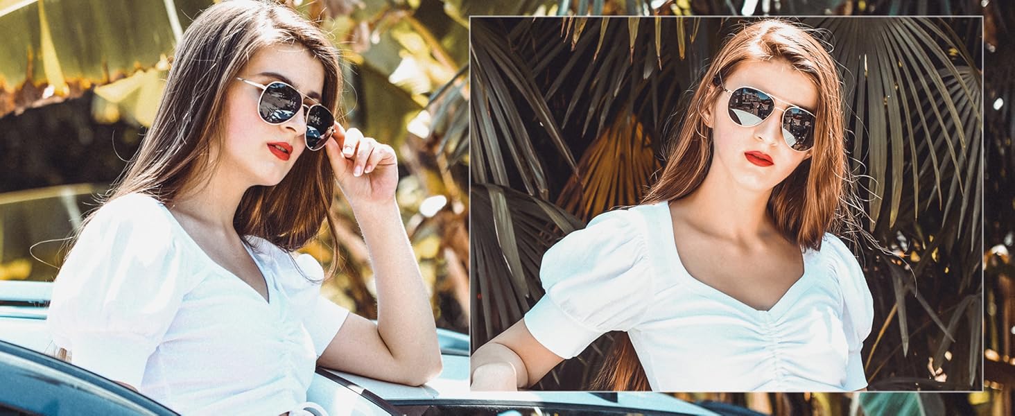 A stylish and elegant lady wearing grey black sunglasses