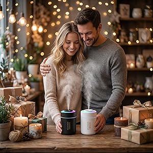 Couple enchanted by a humidifier&amp;#39;s vibrant glow and aromatherapy on a romantic table