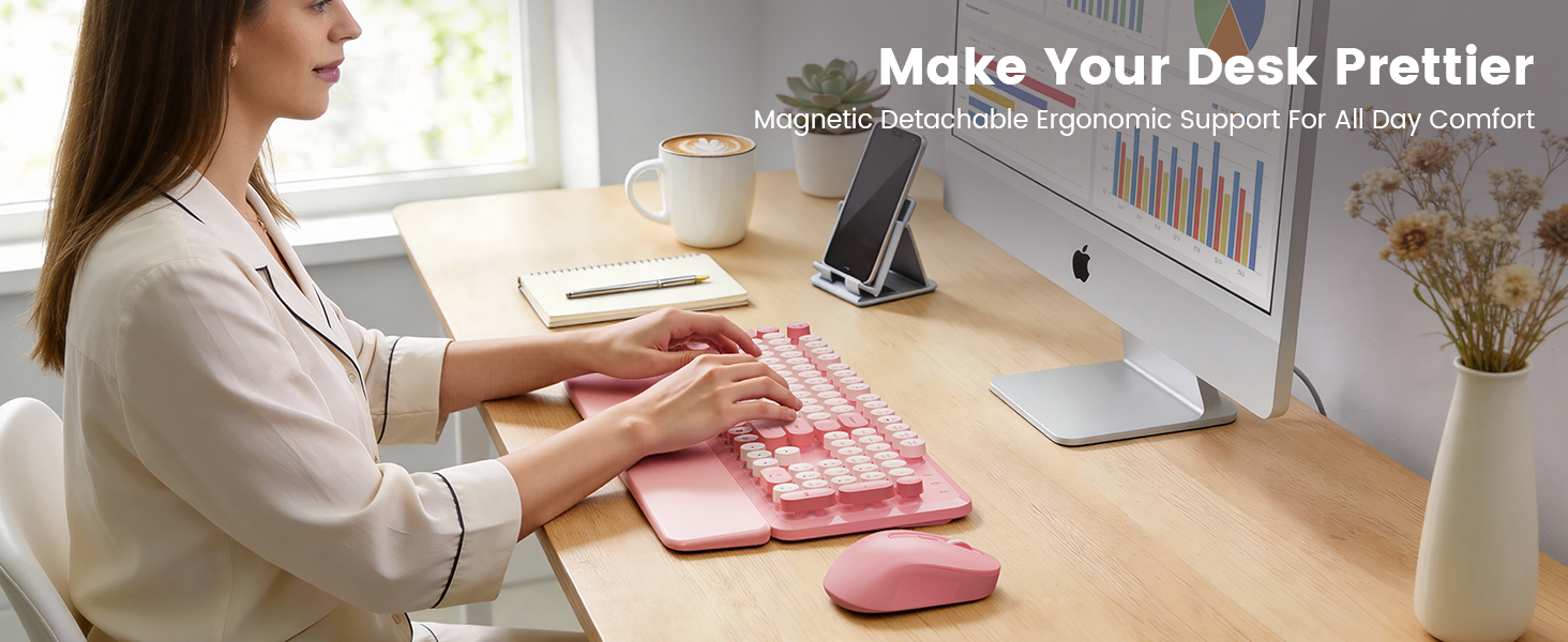 Woman typing on pink wireless keyboard mouse combo with wrist rest on tidy desk