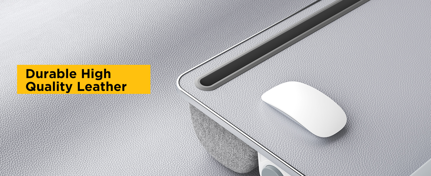 Close-up of textured leather desktop on slip-resistant lap desk with wireless mouse.