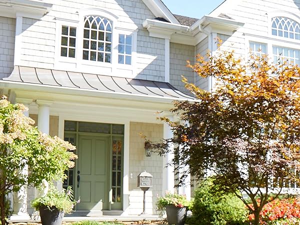 Outdoor view of home from a distance, push button doorbell installed next to door