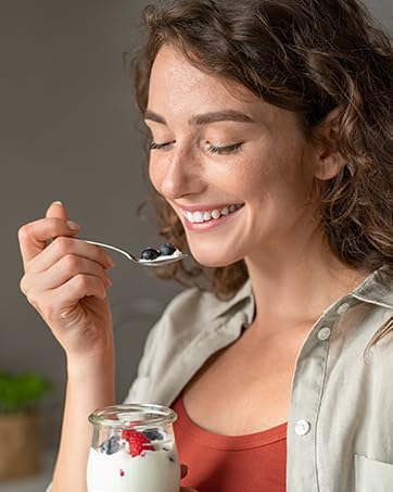 Woman eating Yogurt