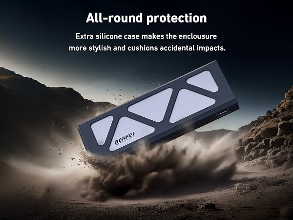 Benfei silicone case for electronic device, floating in dusty desert scene. Black case with triangular cutouts revealing white underneath. Offers impact protection and stylish design.
