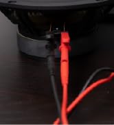 testing leads hooked to a speaker