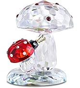 Clear glass or crystal decorative piece featuring a ladybug design with red and black coloring on top, shown from multiple angles.
