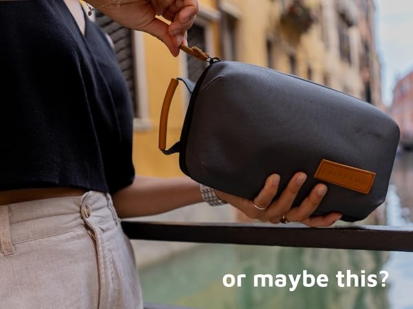 girl holding a camera travel organizer bag in venice italy