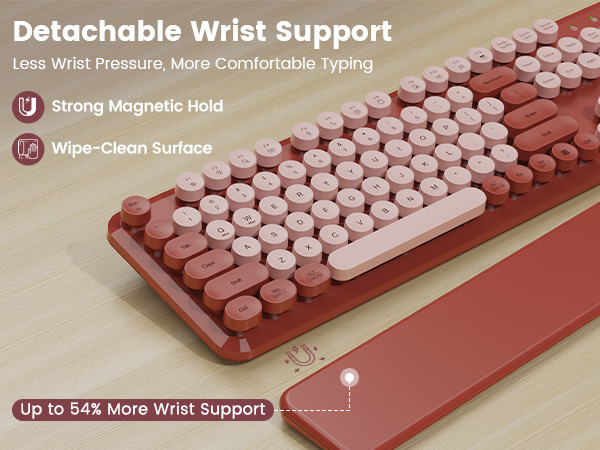 Keyboard on desk with detachable magnetic wrist rest, showing strong hold and wipe-clean surface.
