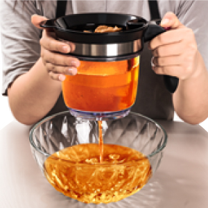 Straining liquid into bowl from Fat Separator.