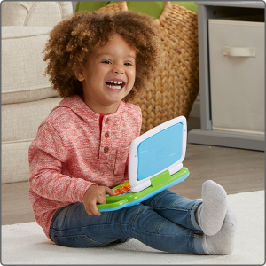 Child laughing with the computer toy