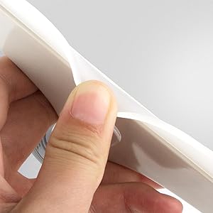 a hand holding a piece of paper with a piece of paper in it.